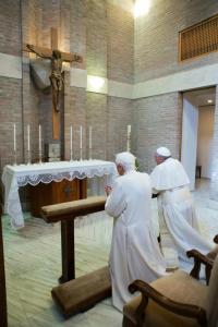 Pope Francis and Benedict XVI praying