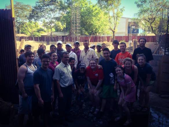Our mission trip team with the workers and Father Antonio.